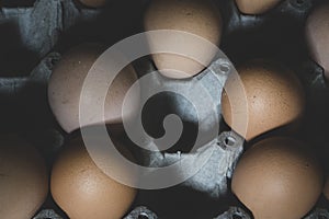 Chicken eggs, brown chicken eggs in a cardboard box