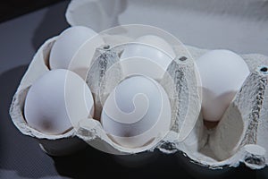 Chicken eggs in a cardboard box