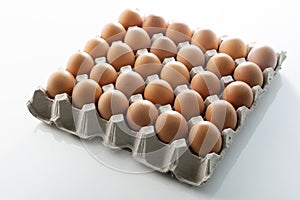 Chicken eggs in carton box on background