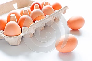 Chicken eggs close-up and egg box