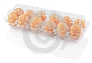 Chicken eggs in a plastic container