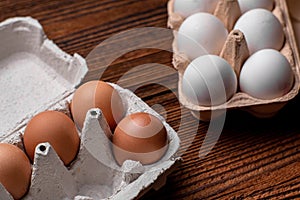 Chicken eggs in a tray - brown and white