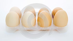 eggs in a tray on a white background