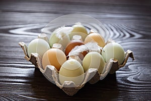 Chicken eggs in tray on wooden table. Nine eggs