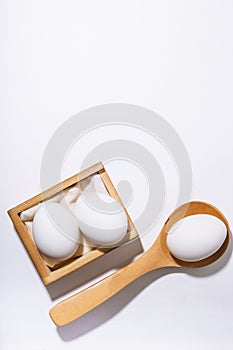 Chicken eggs, white black background with copy space. Food and products containing vitamins, proteins, amino acids, choline,