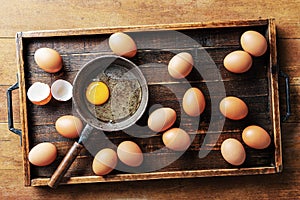 Chicken eggs in wood tray