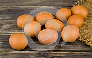 Chicken eggs on wooden background