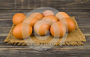 Chicken eggs on wooden background