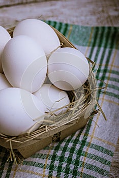 Chicken eggs on a wooden background