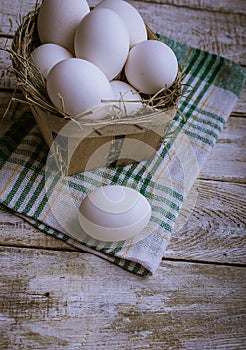 Chicken eggs on a wooden background