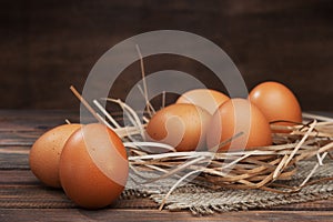 Chicken eggs on wooden background close-up