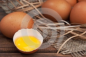 Chicken eggs on wooden background close-up