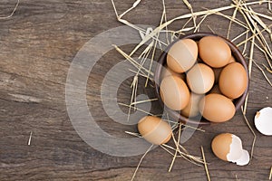 Chicken eggs in a wooden bowl Farm fresh organic eggs laid on a rustic wood