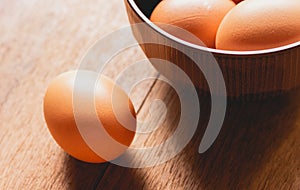 Chicken eggs on wooden table