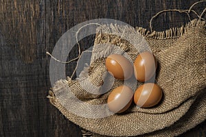 chicken eggs on wooden table