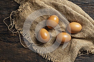 chicken eggs on wooden table