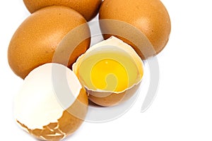 Chicken eggs and yellow yolk isolated on white background. photo