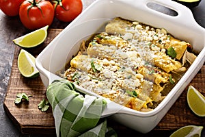 Chicken enchiladas in a casserole dish
