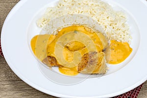 Chicken escalope, curry sauce and rice