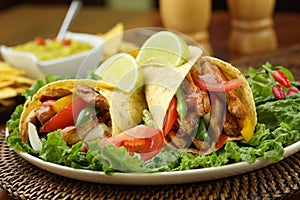 Chicken fajita with guacamole and tortillas