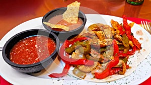 Chicken fajitas with salsa and beans