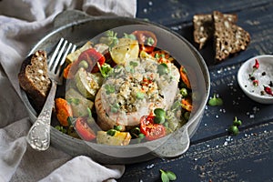 Chicken fillet baked with vegetables in a vintage scourage
