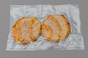 Chicken fillet breaded burger in vacuum packed