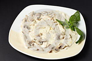 Chicken fillet with mushrooms in creamy sauce. Italian style. It