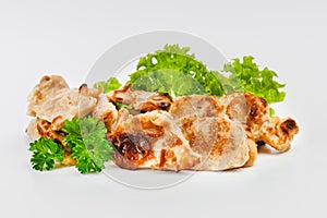 Chicken fillets fried until half cooked, semi-finished product with fresh herbs on a white background. Fast food. Quick