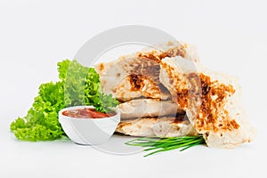 Chicken fillets fried until half cooked, semi-finished product with fresh herbs on a white background. Fast food. Quick