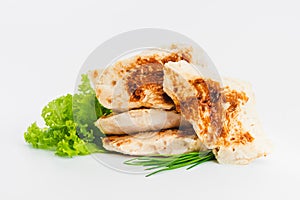 Chicken fillets fried until half cooked, semi-finished product with fresh herbs on a white background. Fast food. Quick