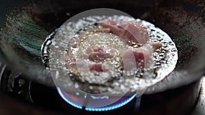 Chicken fire delicious cooking in hot oil on pan, boiling fatty oil is unhealthy for people