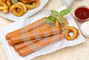 Chicken franks with potato swirls basil and ketchup with mayonnaise