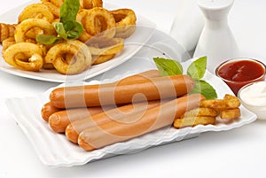 Chicken franks with potato swirls basil and ketchup with mayonnaise