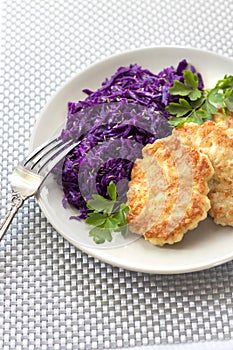 Chicken fritters and stewed red cabbage with caraway