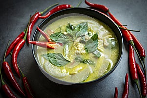 Chicken green curry Thai food on soup bowl with ingredient vegetable herbs and spices pepper chili, Traditional green curry