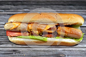 chicken hot dog with thousand island dressing sauce of ketchup mayonnaise, grilled chicken sausage, tomato, lettuce, called wiener