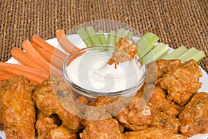 Chicken hot wings and dipping sauce photo