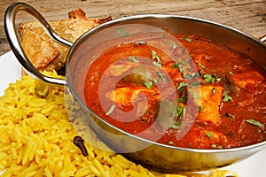 Chicken jalfrezi in balti dish with rice photo