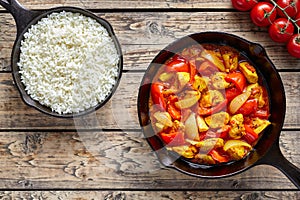 Chicken jalfrezi dietetic traditional Indian curry spicy fried meat with vegetables and basmati rice food photo