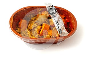 Chicken jalfrezi dish in a plastic bowl