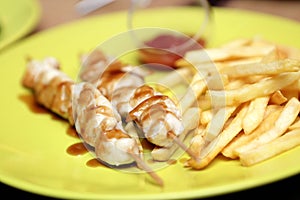 Chicken kebab with french fries and sause