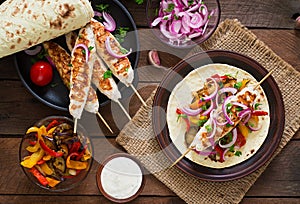 Chicken kebab with grilled vegetables. Top view