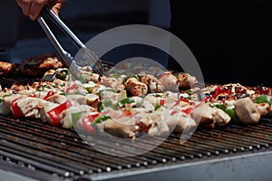 Chicken Kebabs being grilled at an amusement park