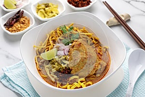 Chicken khoa soi, a type of Thai rice noodle with chicken curry