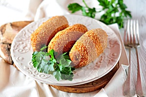 Chicken Kiev cutlets with parsley leaves. Ukrainian tradition food.