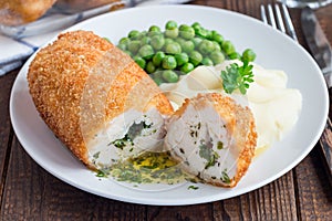 Chicken Kiev, ukrainian cuisine. Cutted chicken cutlet in bread