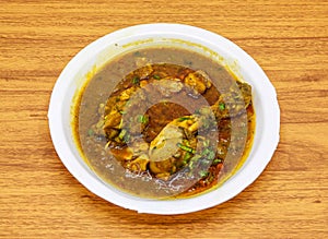 Chicken korma or qorma served in plate isolated on table top view of indian and pakistani spicy food