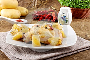 Chicken leg baked with potatoes