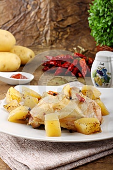 Chicken leg baked with potatoes